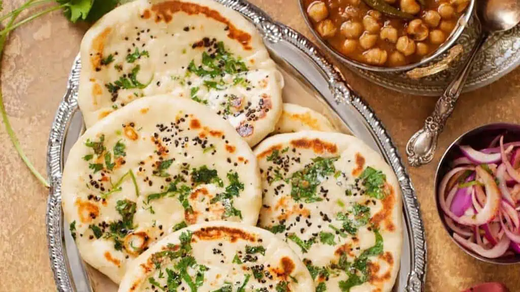 fluffy pieces of bread garnished with leaves on a plate