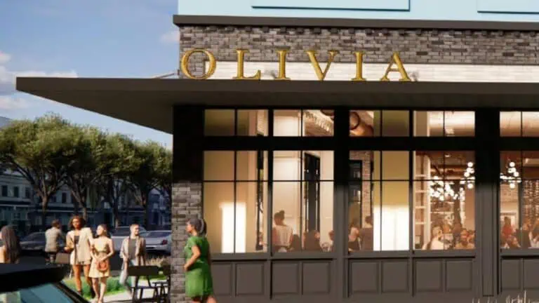 rendering outside a restaurant with a sign reading "Olivia" over the entrance