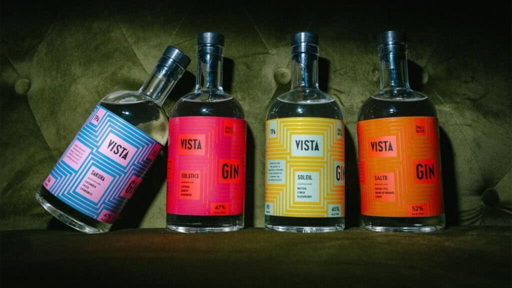 multiple bottles of gin on display in multi color labels 
