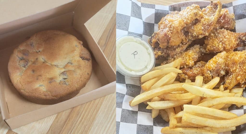 cookie pizza in a box beside chicken wings and fries. Photo via Caleb Bernard.