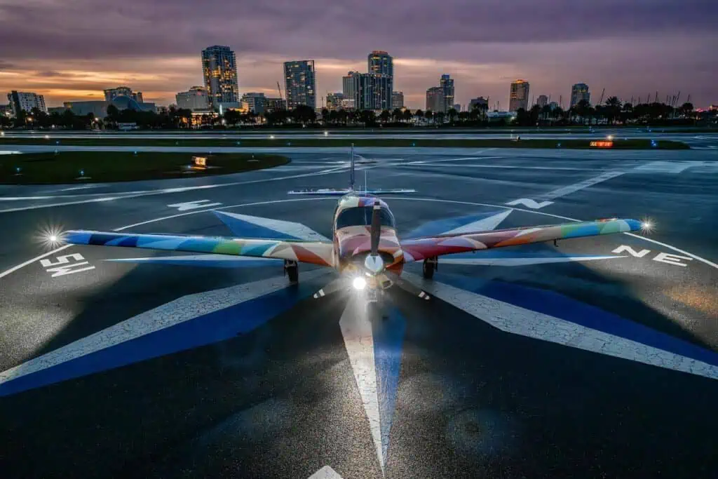 airplane with city in background at duck