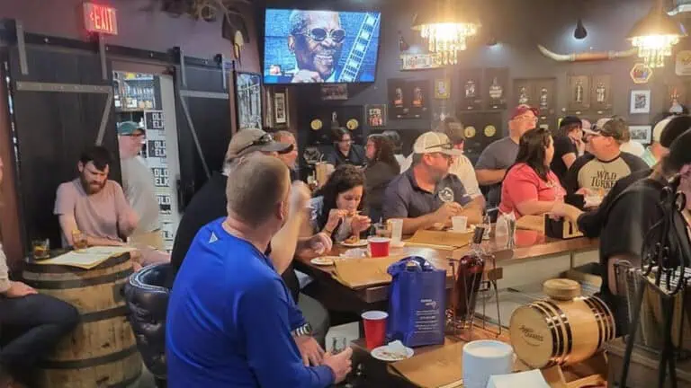 people enjoy drinks at a bar