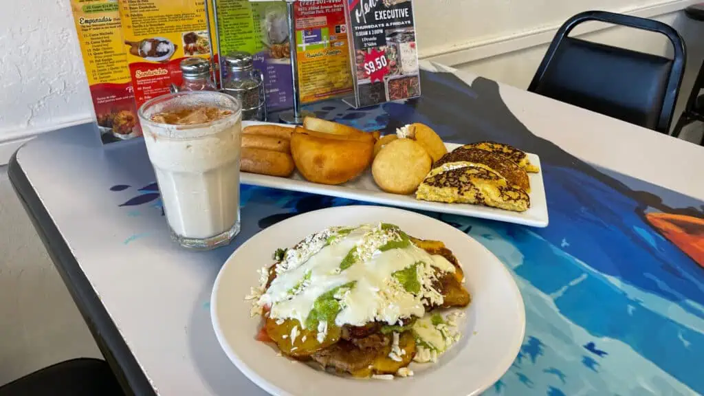 empanadas and more delicious food and an iced coffee drink from alma llanera venezuelan 