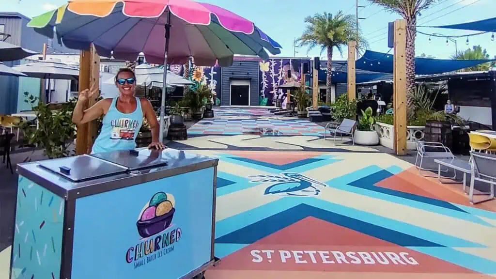 an ice cream cart posted up at an outdoor event