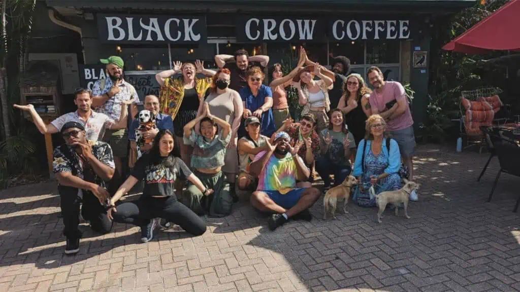 a group of people gather for community poetry at a coffee shop