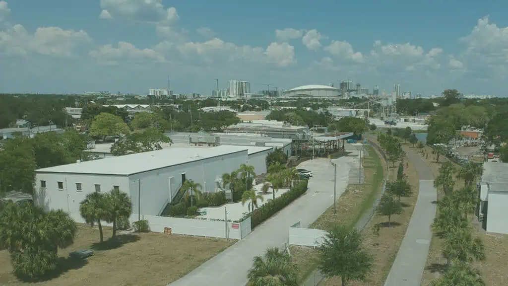 drone footage of downtown area with large warehouses