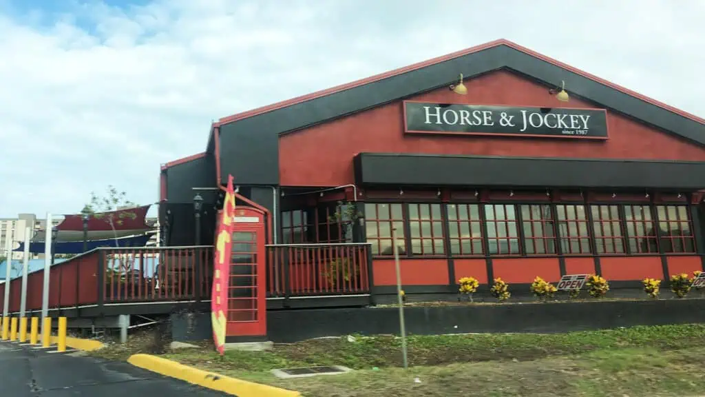 exterior of a British pub with a red paint job