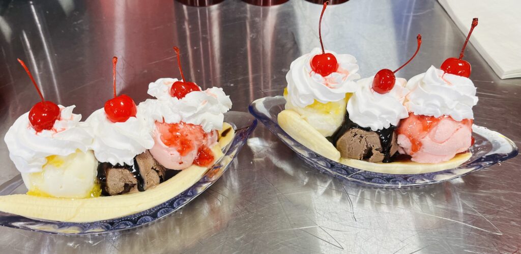 two sundaes on steel counter