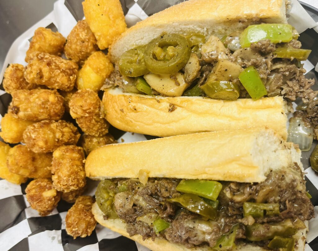 Philly cheese steak sandwich in a basket.