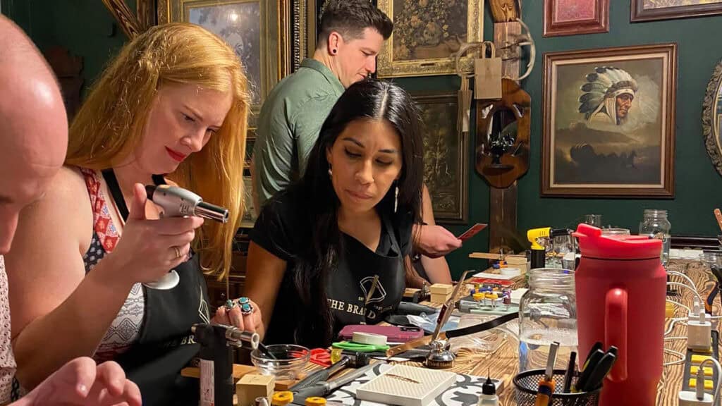 people making rings at a workshop 