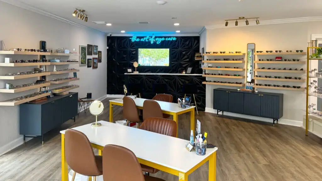 the modern interior of an eye doctor office with shelves of glasses