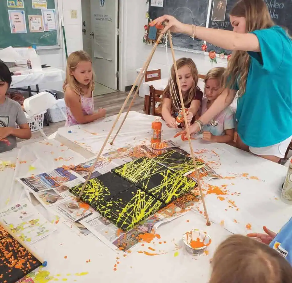 kids doing pendulum art 