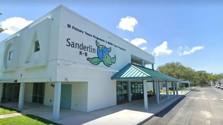 exterior of a school with a turtle mural on the front