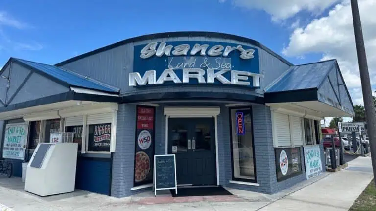 exterior of a deli with a blue paint job