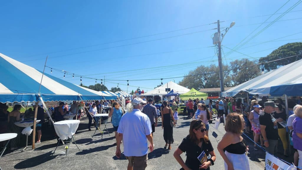 guests stroll vendor tents during a food festival