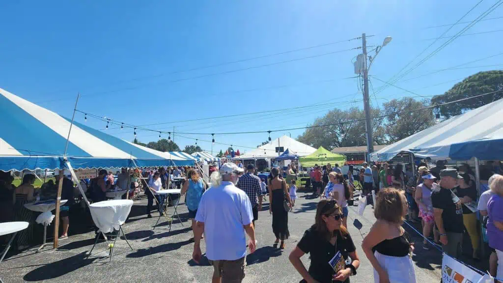 guests stroll vendor tents during a food festival