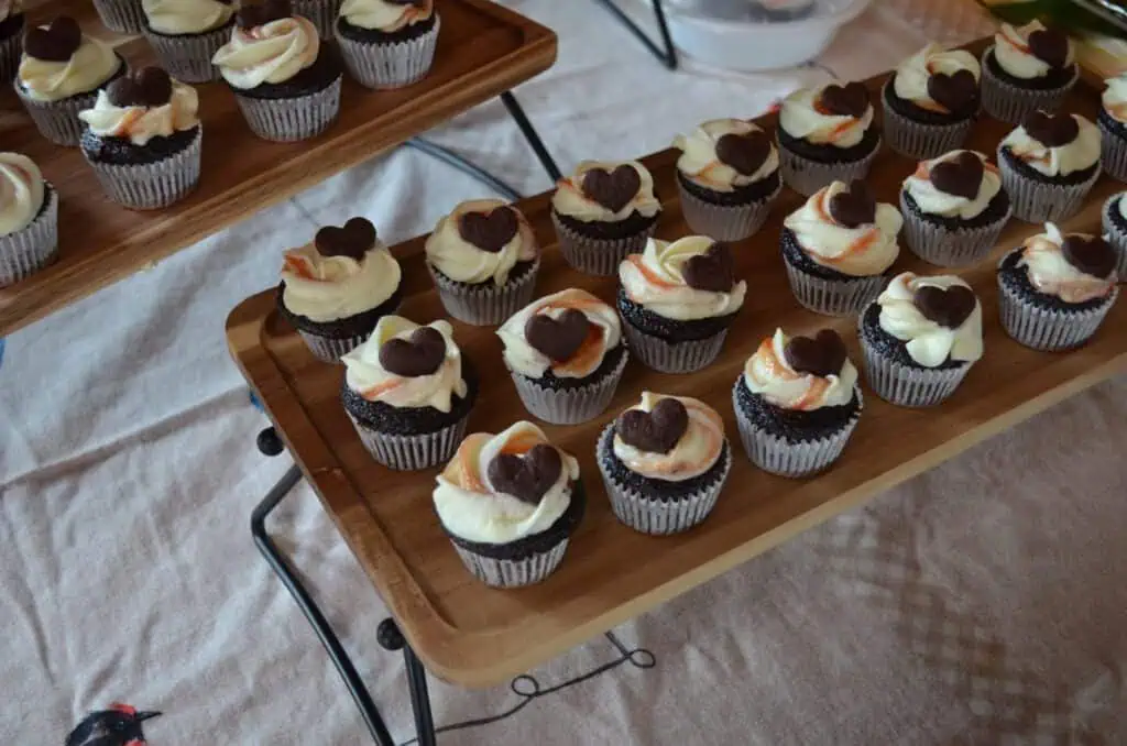 cupcakes with heart shaped chocolates on top 