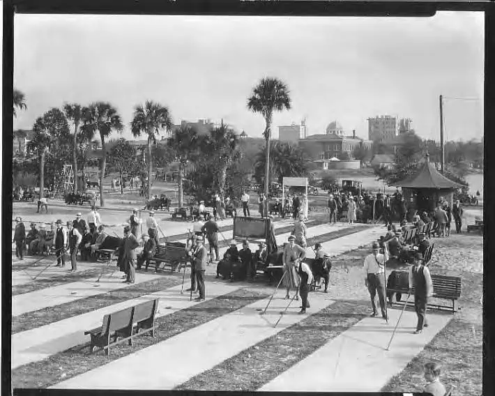 Historic black and white photo of people playing shuffleboard at Mirror Lake.