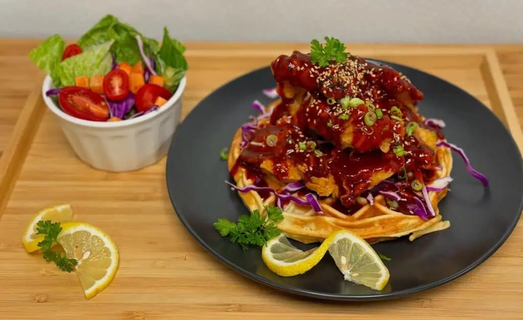 food on plate with lemon slices.