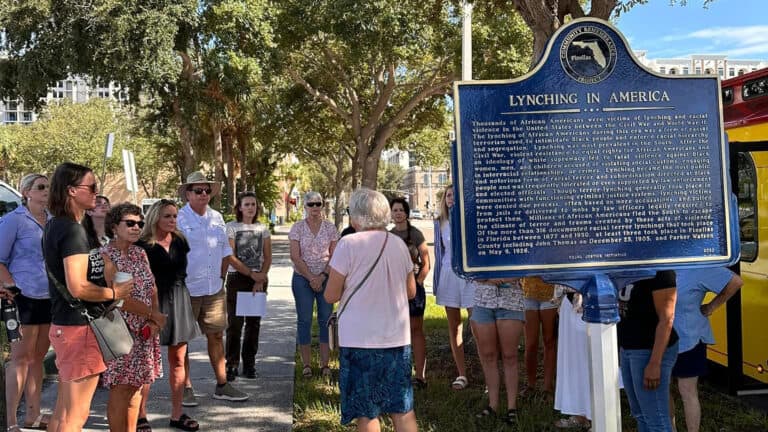 people walk on a historic trail