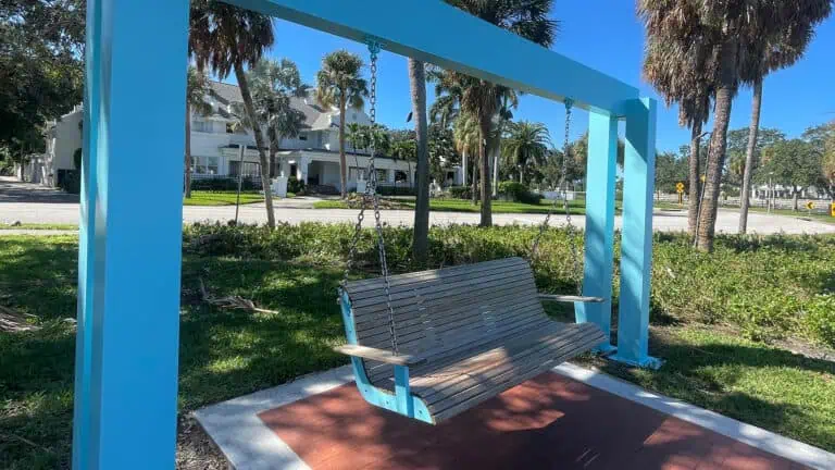 a waterfront swinging bench