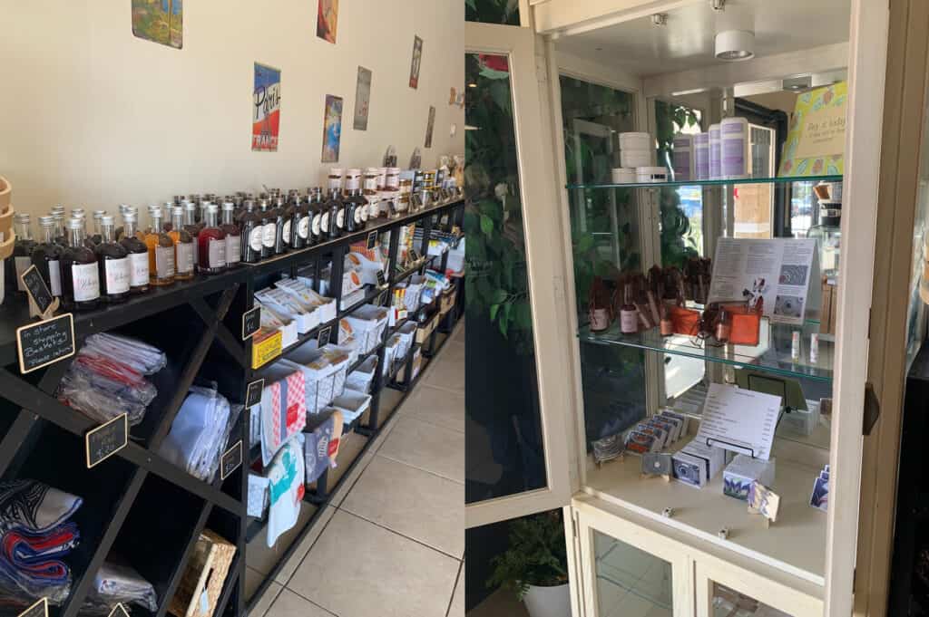 Shelves and display cases are filled with bottles, packaged goods, and small items inside a shop.