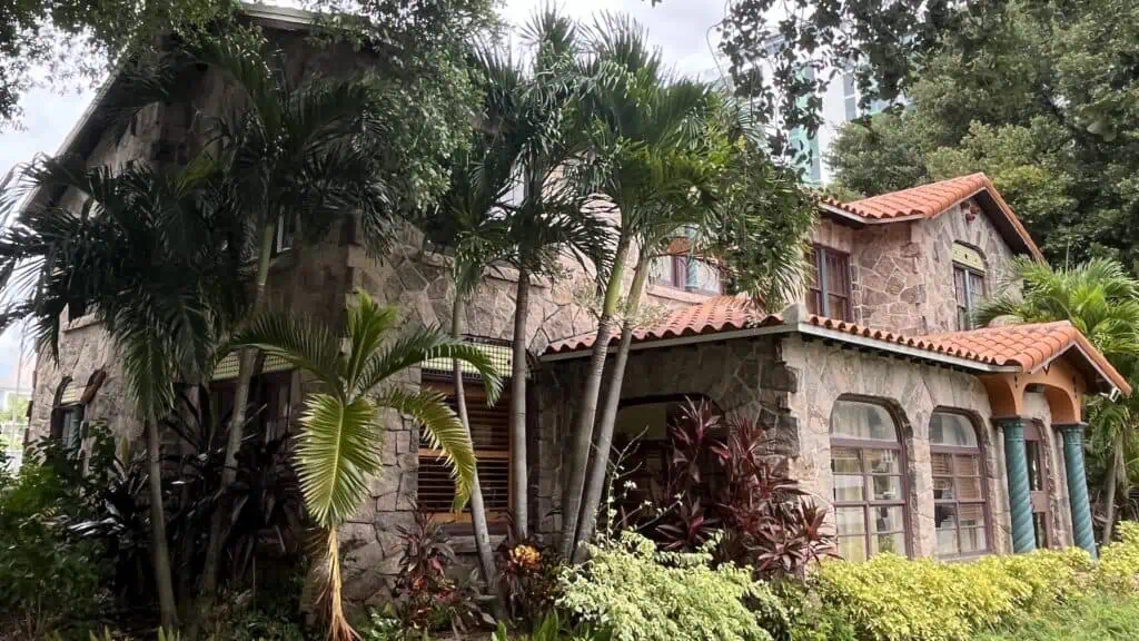 Color photo of a stone house on Mirror Lake