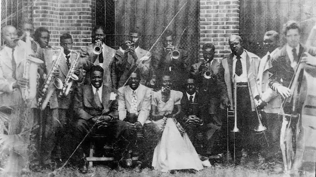 a black and white photo of a brass orchestra