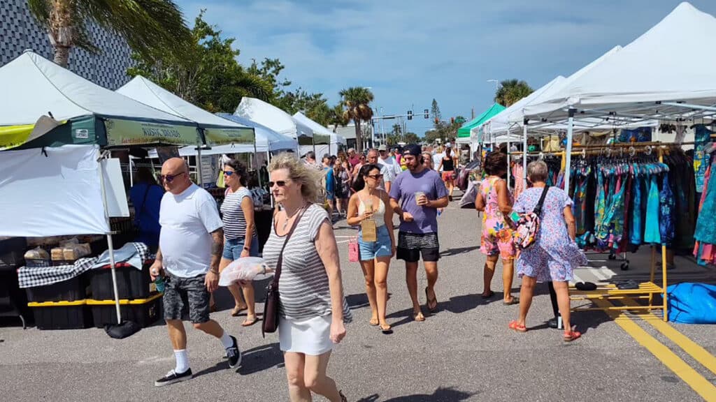 a group of people shopping at a local market