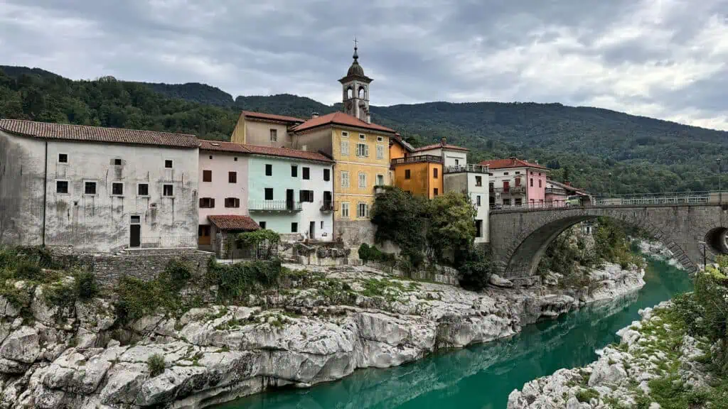 View of colorful old buildings and bridge over a river running through