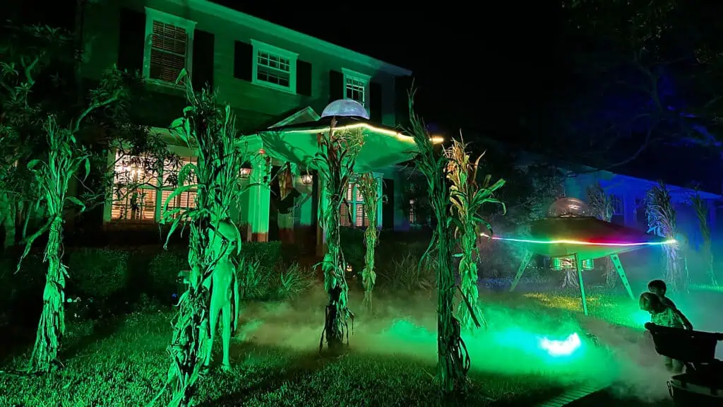 alien spaceships set up in front of a house