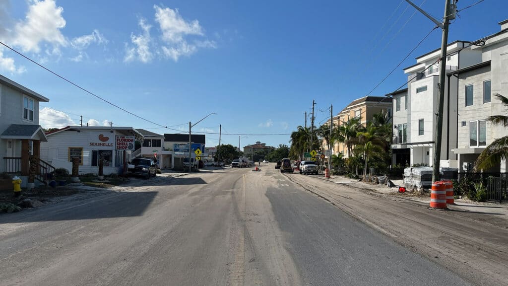 a beach side street cleared of brush and sand