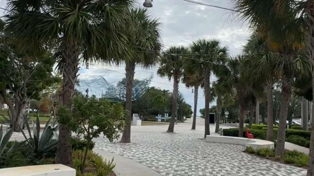 entrance to the St. Pete Pier with a brick lined sidewalk