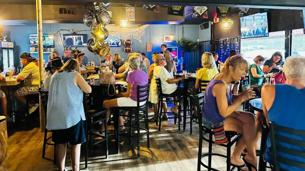 a group of people in a tiki bar