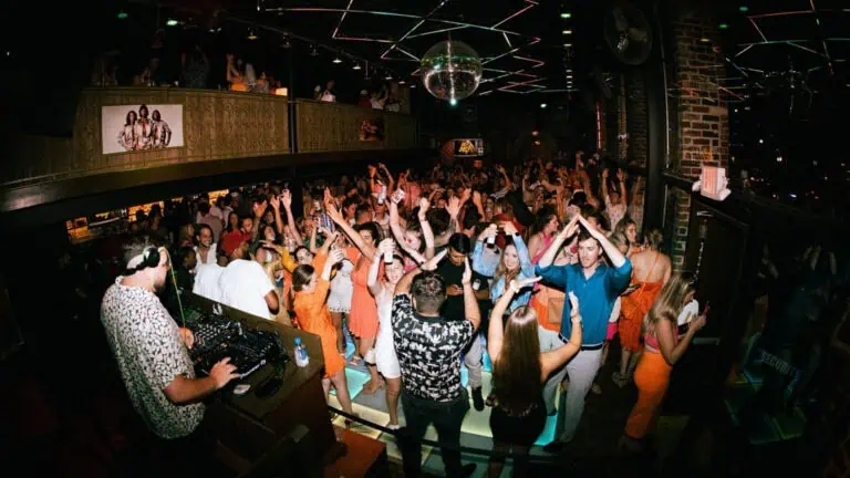 People dancing at a bar