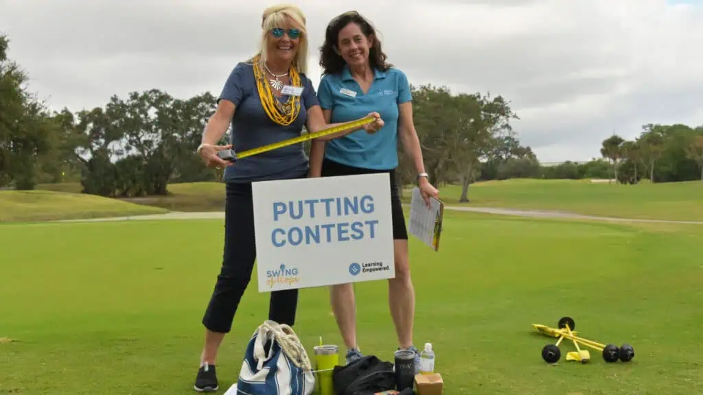 People at a golf tournament