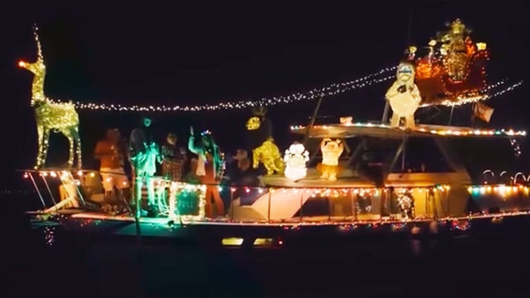 a boat covered in Christmas lights