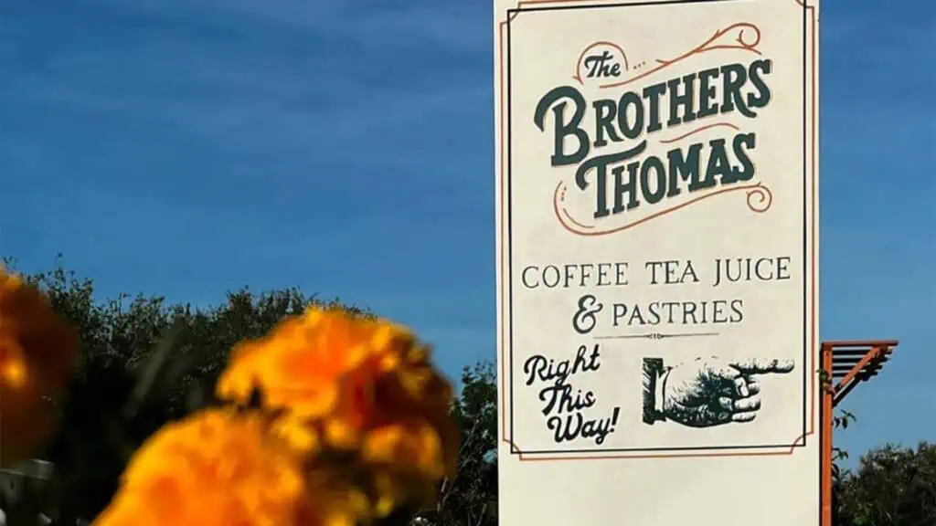 exterior of a cafe with a large sign reading "The Brothers Thomas"