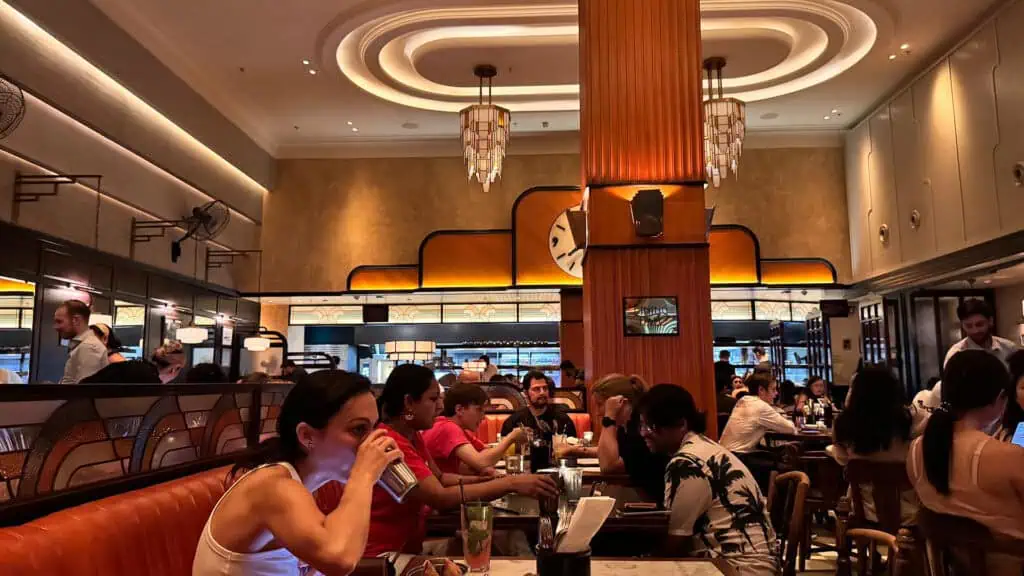 People dining inside a art deco designed restaurant interior