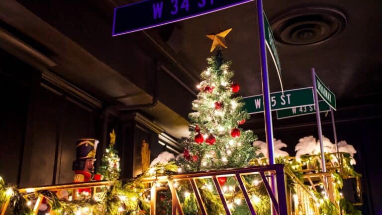 Christmas decorations displayed inside of a bar