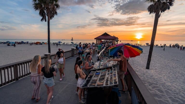 a sunset event on a pier with multiple vendors present