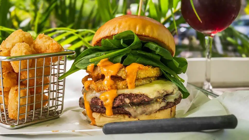 a large burger on a plate