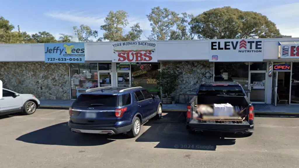 Strip mall with cars parked