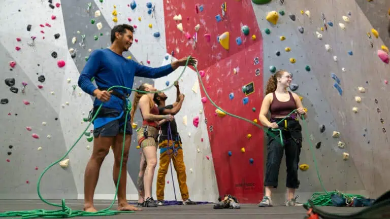 People rock climbing