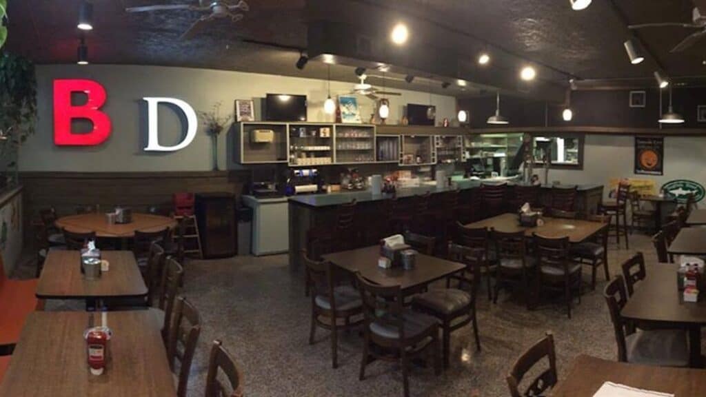 interior of a small diner with the letters "B" and "D" set up in the far corner