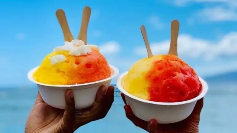 two cups of shave ice with red and yellow coloration