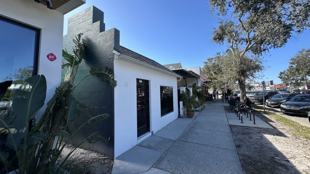 exterior of a bar with a black paint job on the side