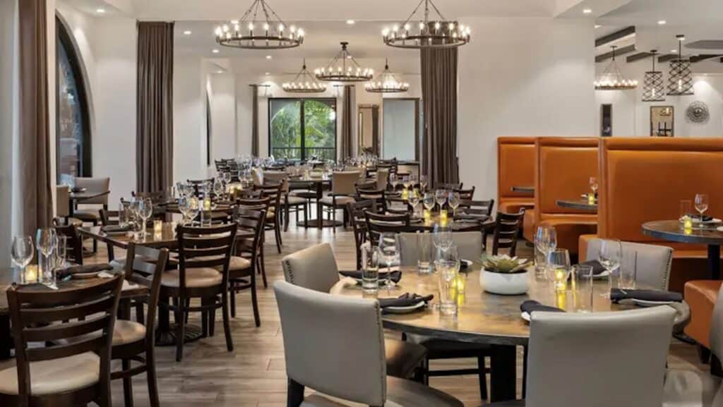 interior of a restaurant with multiple tables arranged offering great water views