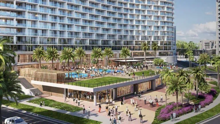 exterior rendering of a luxury resort on the beach. a rooftop pool deck is visible