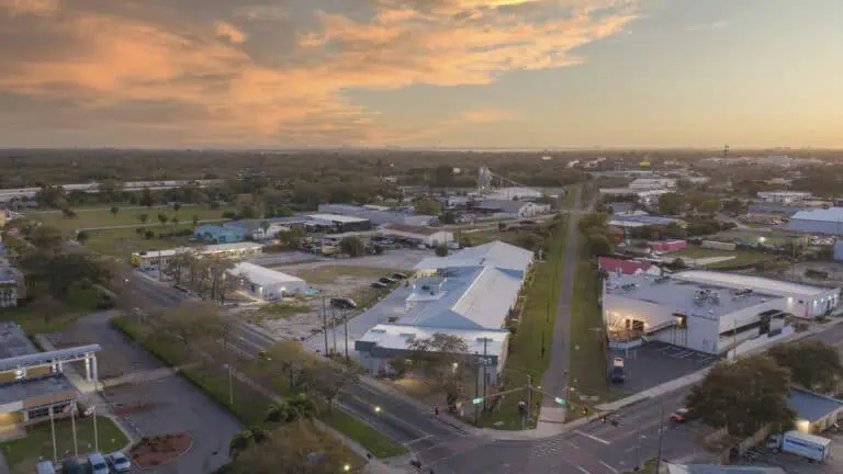 aerial view of warehouses and cross streets at dusk.